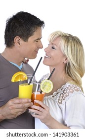 Mature Couple Celebrating With Cocktails, Studio Shot, Isolated