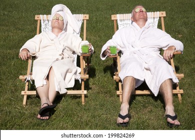 Mature Couple Detoxing During A Do It Yourself Spa Day In Their Backyard