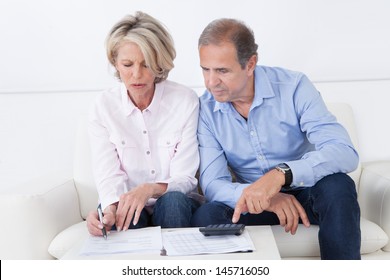 Mature Couple Doing Family Finances At Home