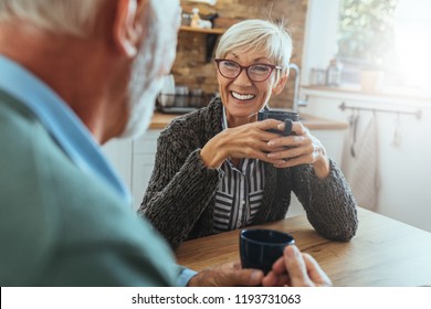 Mature Couple Drinking Coffee In The Morning