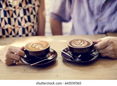 Mature Couple Drinking Coffee Together