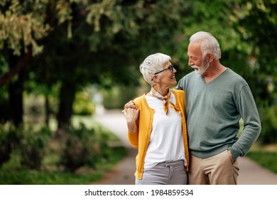 Mature Couple, Enjoying A Nice Day, While Walking, Outside.