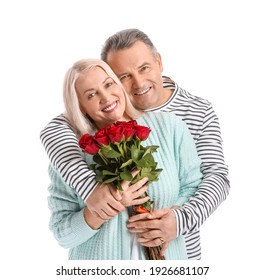 Mature Couple With Flowers On White Background. Valentine's Day Celebration