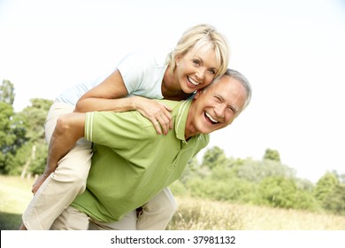 Mature Couple Having Fun In Countryside