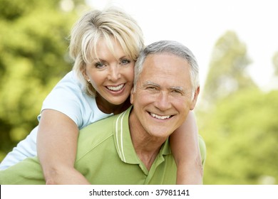 Mature Couple Having Fun In Countryside