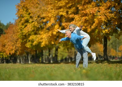 Mature Couple Having Fun In The  Park