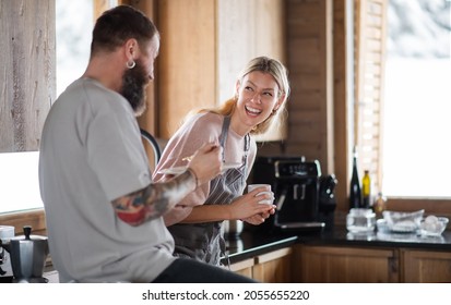 Mature Couple Having Fun When Cooking And Eating Indoors In Kitchen, Winter Holiday In Private Apartment.