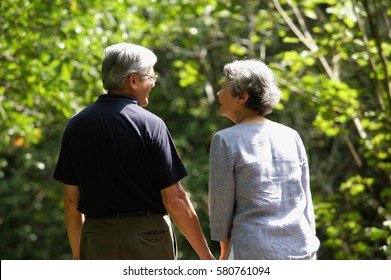 Mature Couple, Holding Hands, Rear View