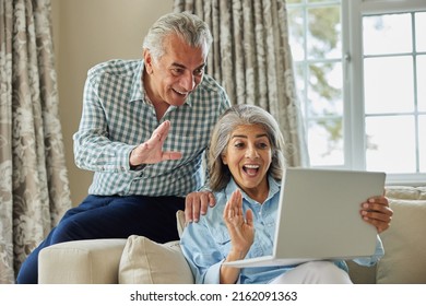 Mature Couple At Home Having Video Chat With Family