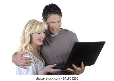 Mature Couple Looking At Notebook, Studio Shot, Isolated