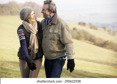 Mature Couple On Country Walk In Winter