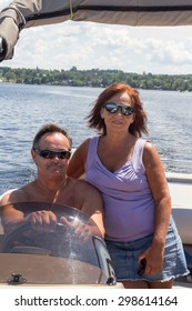 Mature Couple On A Pontoon Boat At Summer