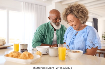 Mature Couple On Vacation Or At Home Eating Breakfast Together - Powered by Shutterstock