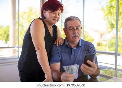 Mature couple online shopping using smart phones ordering bank credit card.
 - Powered by Shutterstock