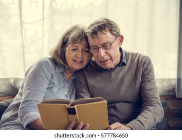 Mature Couple Reading Books Together