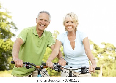 Mature Couple Riding Bikes