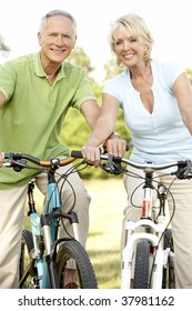 Mature Couple Riding Bikes