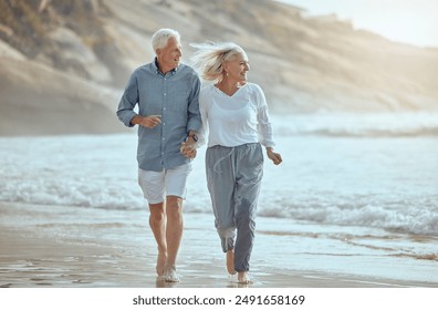 Mature, couple and running on beach with love on retirement vacation, romance and together with fun or freedom. Man, woman and holding hands by ocean on holiday, happy and bonding with energy. - Powered by Shutterstock