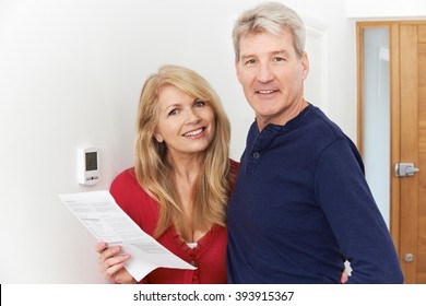 Mature Couple Saving Money On Domestic Heating Bills