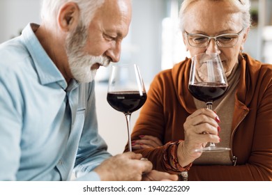 Mature Couple Smelling The Wine At Home