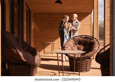 Mature couple spending time on terrace of country house - Shutterstock ID 2325490945