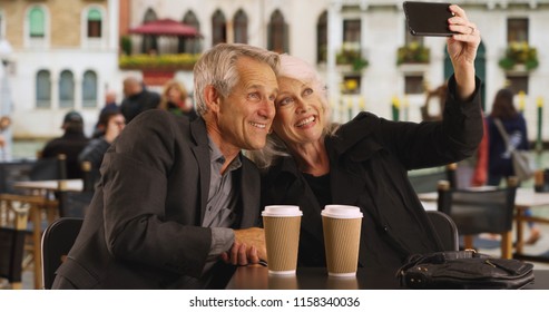 Mature Couple Taking A Selfie In Venice