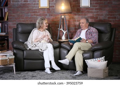 Mature couple talking and sitting close at home - Powered by Shutterstock