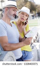 Mature Couple Of Tourists Finding The Right Direction