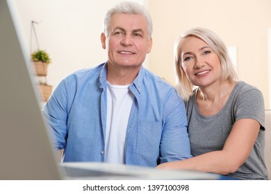 Mature Couple Using Video Chat At Home