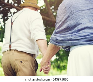 Mature Couple Walking Together Outdoors Concept