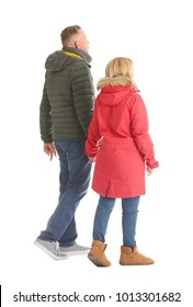 Mature Couple In Warm Clothes Walking On White Background