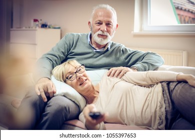 Mature Couple Watching Television.