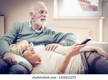 Mature Couple Watching Television.