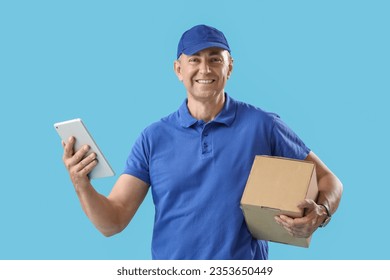 Mature courier with tablet computer and parcel on blue background