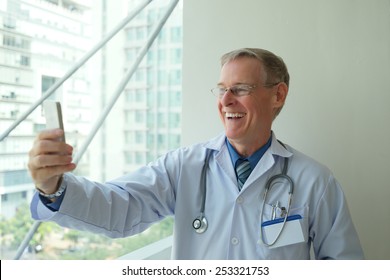 Mature Doctor Taking Selfie
