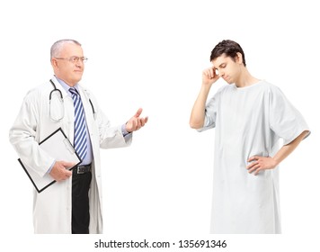 Mature Doctor Talking To A Worried Male Patient, Isolated On White Background