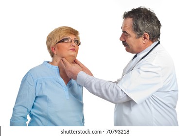 Mature endocrinologist checking goiter to a middle aged patient woman with glasses isolated on white background