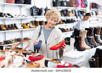 Mature European Woman Who Came To A Shoe Store For Shopping, Chooses Ballet Flats