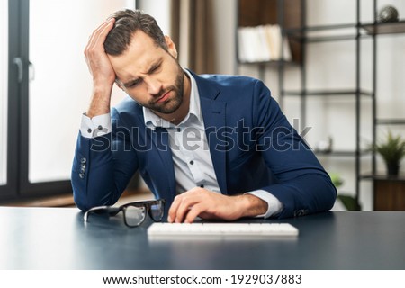 Mature exhausted businessman thinking about budget and future of his company, overworked, bankrupt, unmotivated man sitting at keyboard, feeling stress and disinterest in work, lost the court case Сток-фото © 