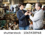Mature family couple buying antique things at the fleamarket outdoor