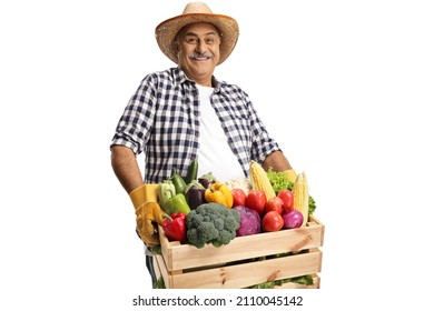 Mature farmer carrying a crate full of fresh vegetabales isolated on white background - Powered by Shutterstock