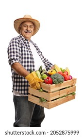 Mature Farmer Holding A Crate Full Of Fresh Organic Vegetables  Isolated On White Background