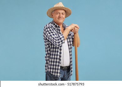 Mature Farmer Posing On Blue Background