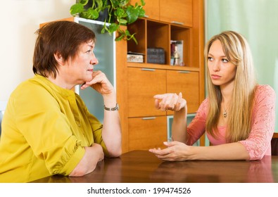 Mature Female With Adult Daughter  Sharing Bad News At Home