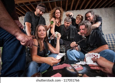 Mature Female Biker Gang Member Shows Cards To Aggressive Players