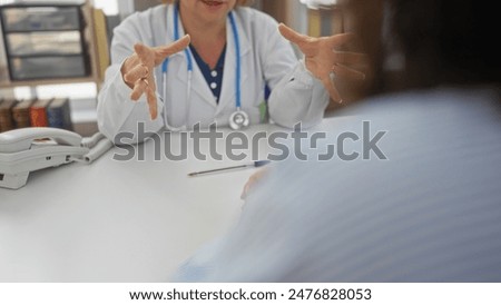 Similar – Doctor giving a prescription to senior patient