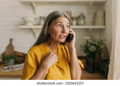 Mature female explain her point of view via smartphone, facial expression, surprised and try to prove something. Phone call, technology, communication, emotional, growing old, discussion concept - Powered by Shutterstock