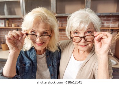 Mature Female Friends Observing Something Interesting