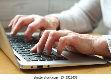 Mature Female Hands Typing Text On Keyboard, Senior Elderly Business Woman Working On Laptop, Old Or Middle Aged Lady Using Computer Concept Writing Emails, Communicating Online, Close Up View.