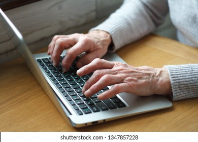 Mature Female Hands Typing Text On Keyboard, Senior Elderly Business Woman Working On Laptop, Old Or Middle Aged Lady Using Computer Concept Writing Emails, Communicating Online, Close Up View.